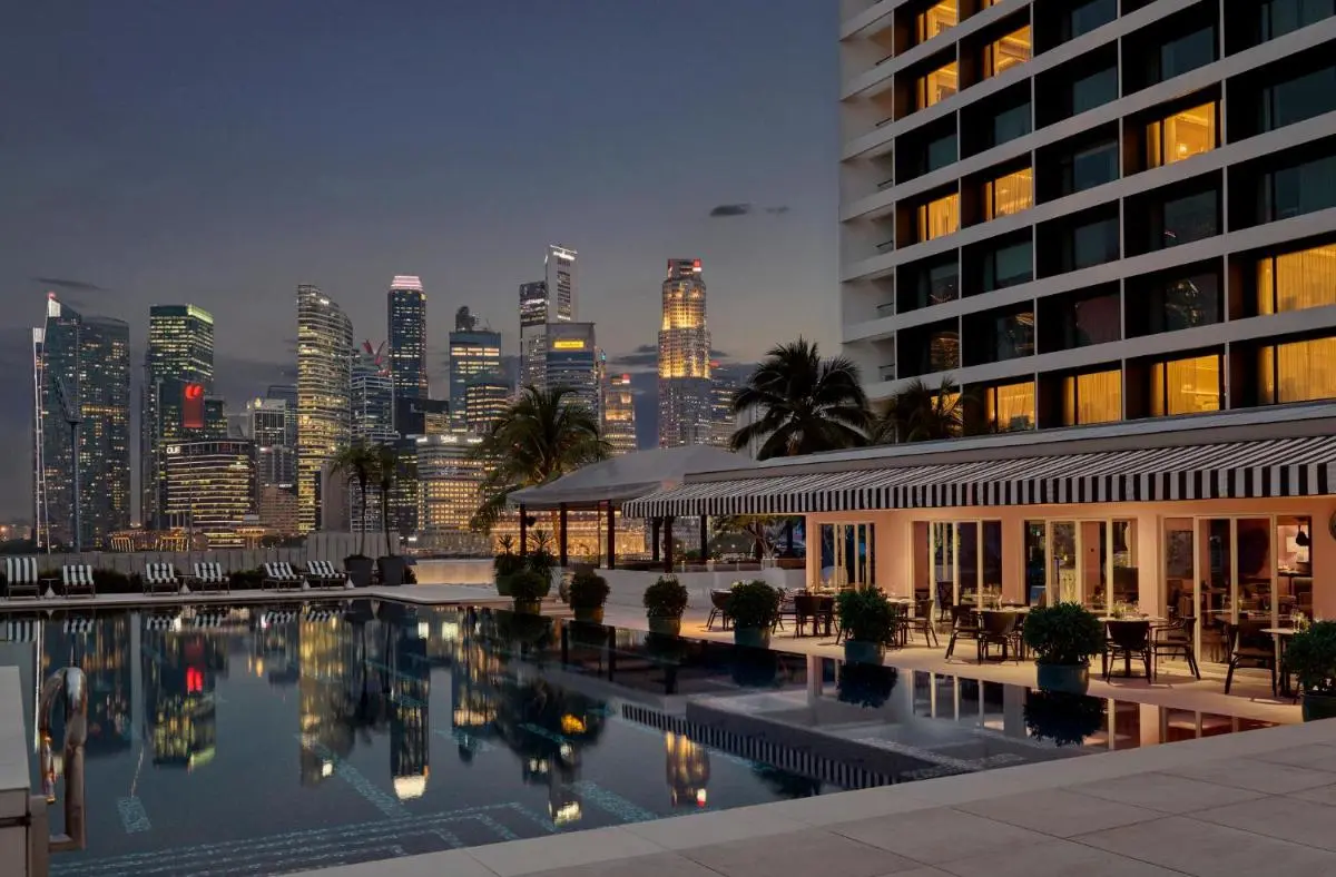 Outdoor Pool Area with Lounge Seating and City Views in Marina Bay