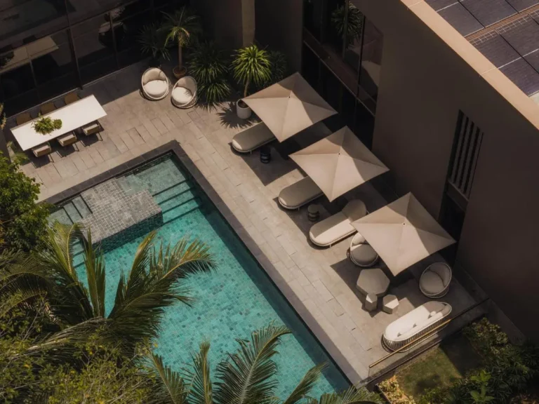 Outdoor Pool Area with Lounge Seating and Dining Space on Sentosa Island