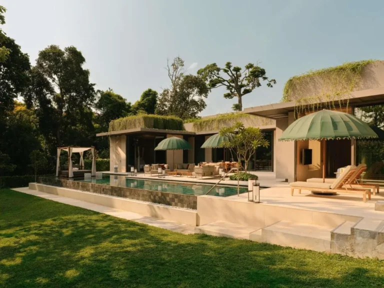 Outdoor Pool Area with Lounge Seating and Greenery on Sentosa Island