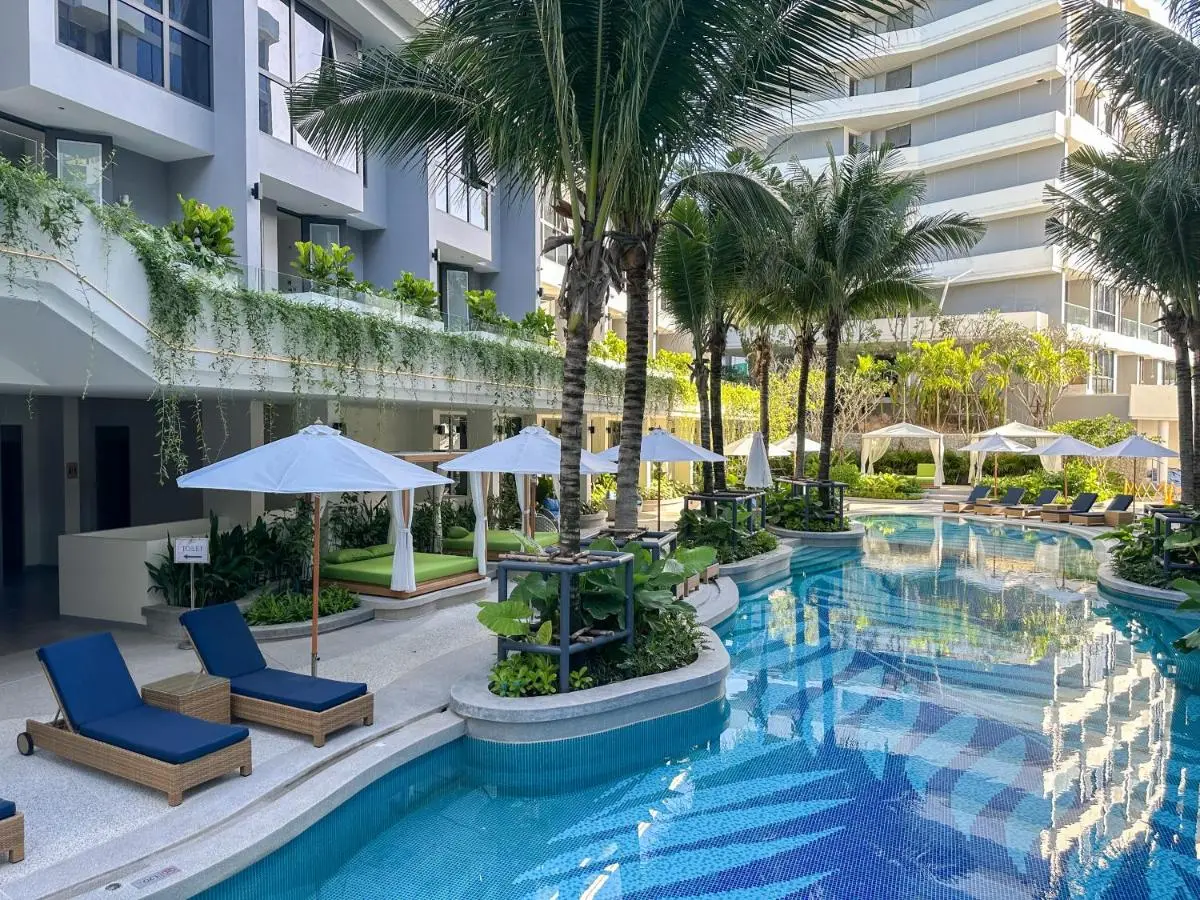 Phuket Province Outdoor Pool Area with Lounge Seating and Palm Trees at Bang Tao Beach