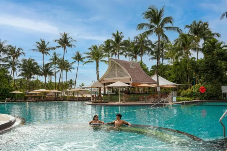 Outdoor Pool Area with Lounge Seating and Shaded Relaxation in Singapore