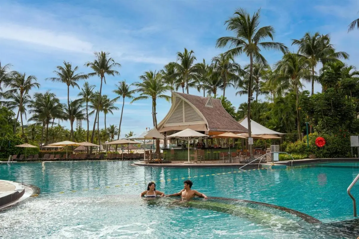 Outdoor Pool Area with Lounge Seating and Shaded Relaxation in Singapore