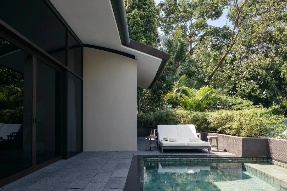 Singapore Outdoor Pool Area with Lounge Seating and Stone Deck on Sentosa Island
