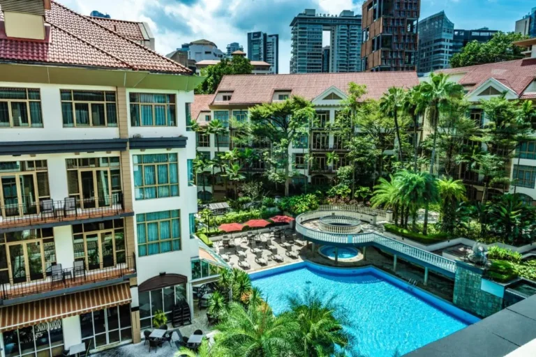 Outdoor Pool Area with Lounge Seating and Tropical Landscaping in Singapore City