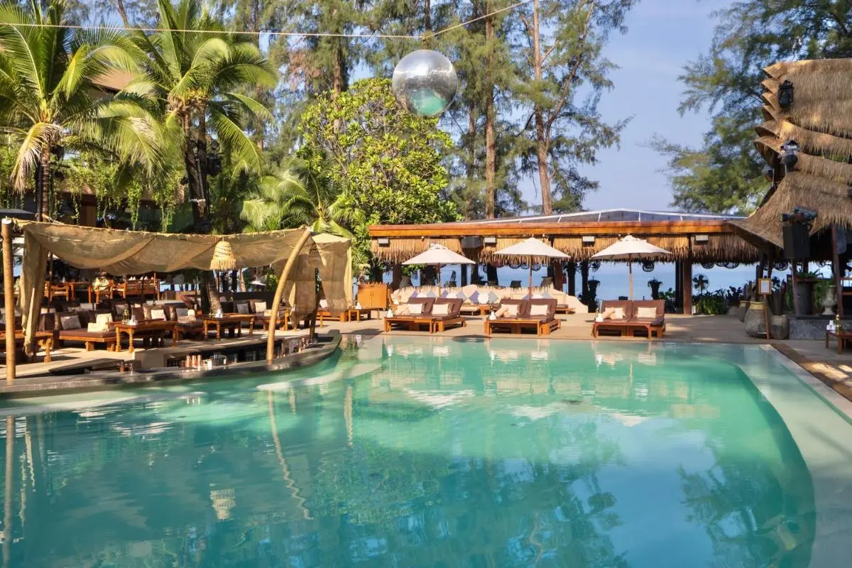 Outdoor Pool Area with Lounge Seating and Tropical Views at Kamala Beach