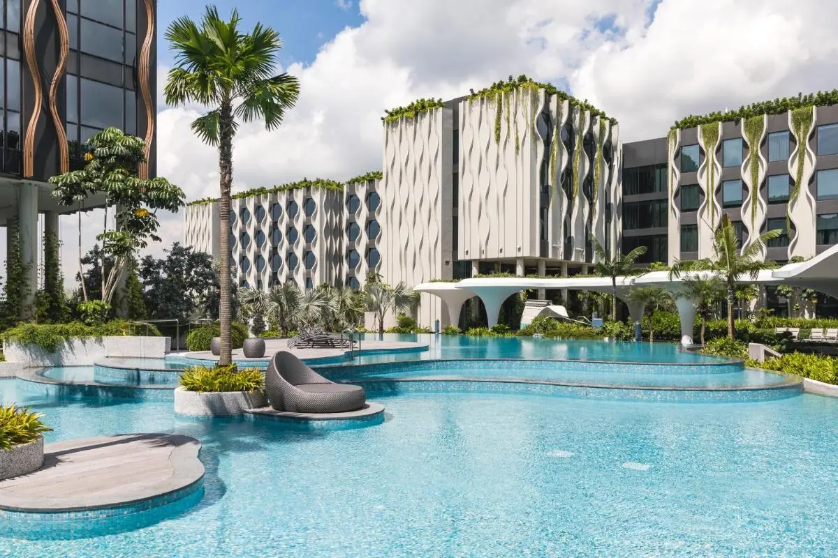 Outdoor Pool Area with Seating and Greenery on Sentosa Island