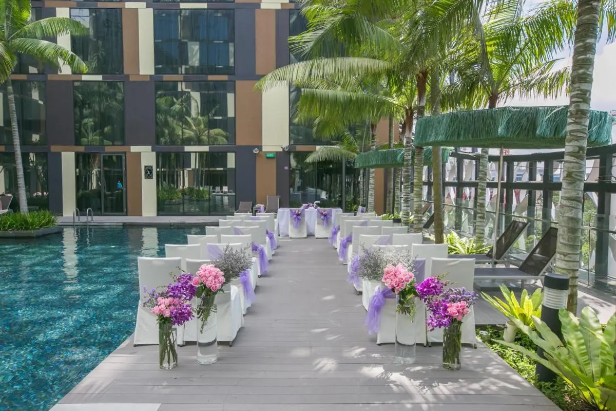 Outdoor Pool Area with Seating and Shaded Lounge Near Changi