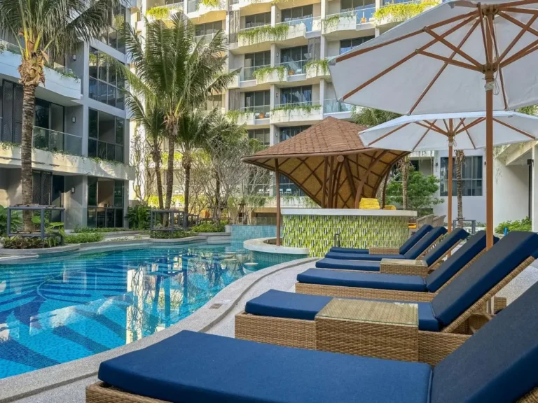 Outdoor Pool Area with Swim-Up Bar and Lounge Chairs at Bang Tao Beach