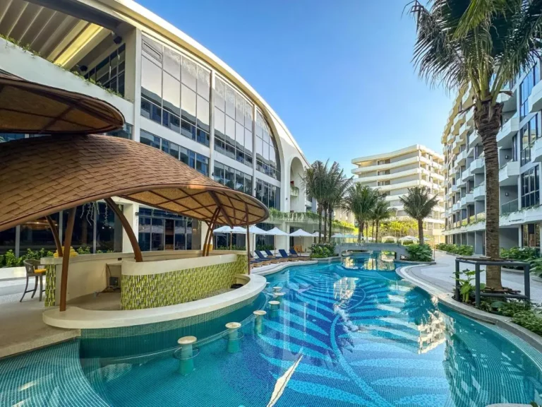 Outdoor Pool Area with Swim-Up Bar and Lounge Chairs at Bang Tao Beach