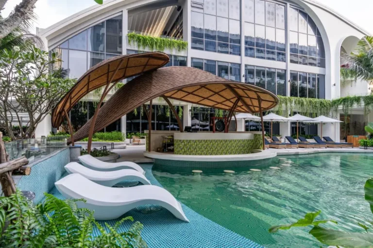 Outdoor Pool Area with Swim-Up Bar and Lounge Seating at Bang Tao Beach