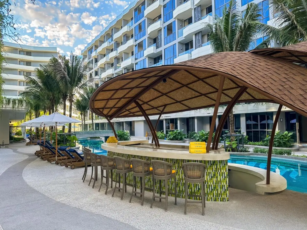 Outdoor Pool Area with Swim-Up Bar and Lounge Seating at Bang Tao Beach