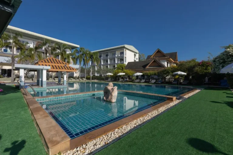 Outdoor Pool Area with Swim-Up Bar and Lounge Seating at Rawai Beach Resort
