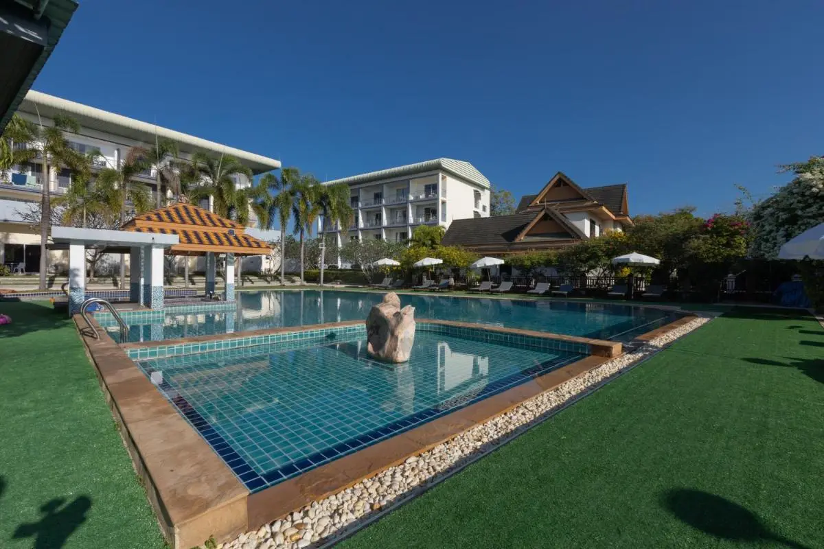 Outdoor Pool Area with Swim-Up Bar and Lounge Seating at Rawai Beach Resort
