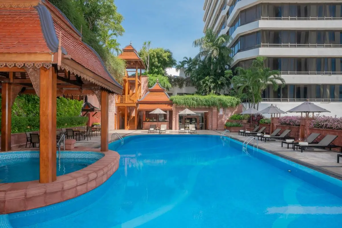 Outdoor Pool Area with Swim-Up Bar and Lounge Seating in Khlong Toei Bangkok