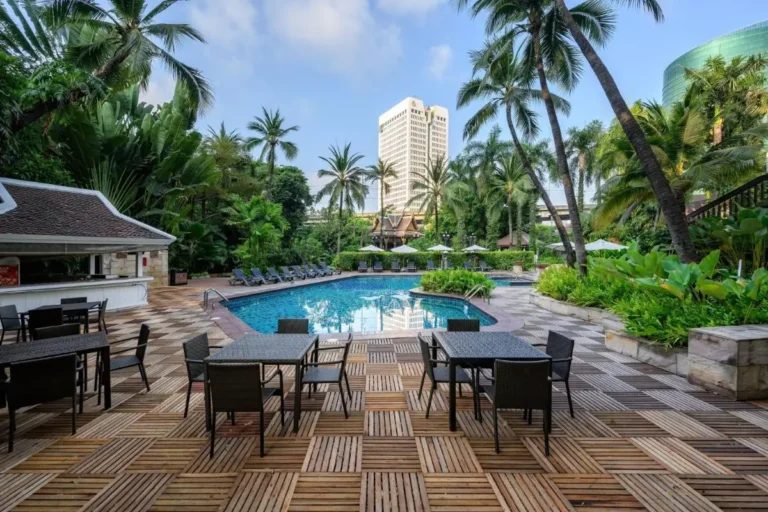Outdoor Pool Area with Tropical Vegetation and Urban Views in Chatuchak Bangkok
