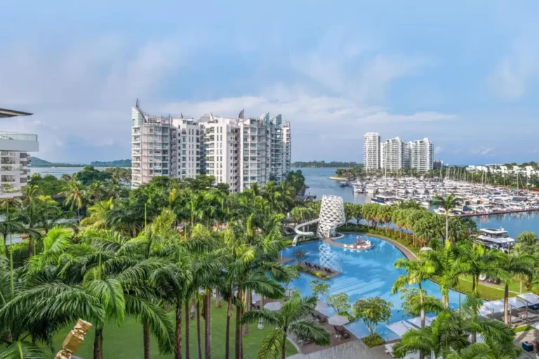 Outdoor Pool Area with Water Slide and Marina Views on Sentosa Island