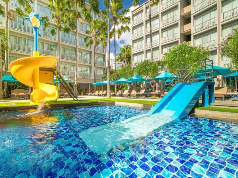 Outdoor Pool Area with Water Slides and Lounge Chairs at Patong Beach