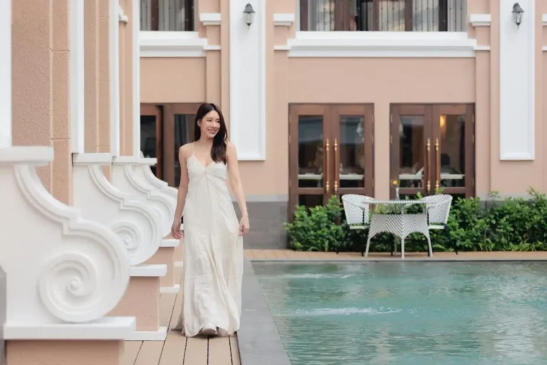 Outdoor Pool Area with Wooden Deck and Seating in Chiang Mai City