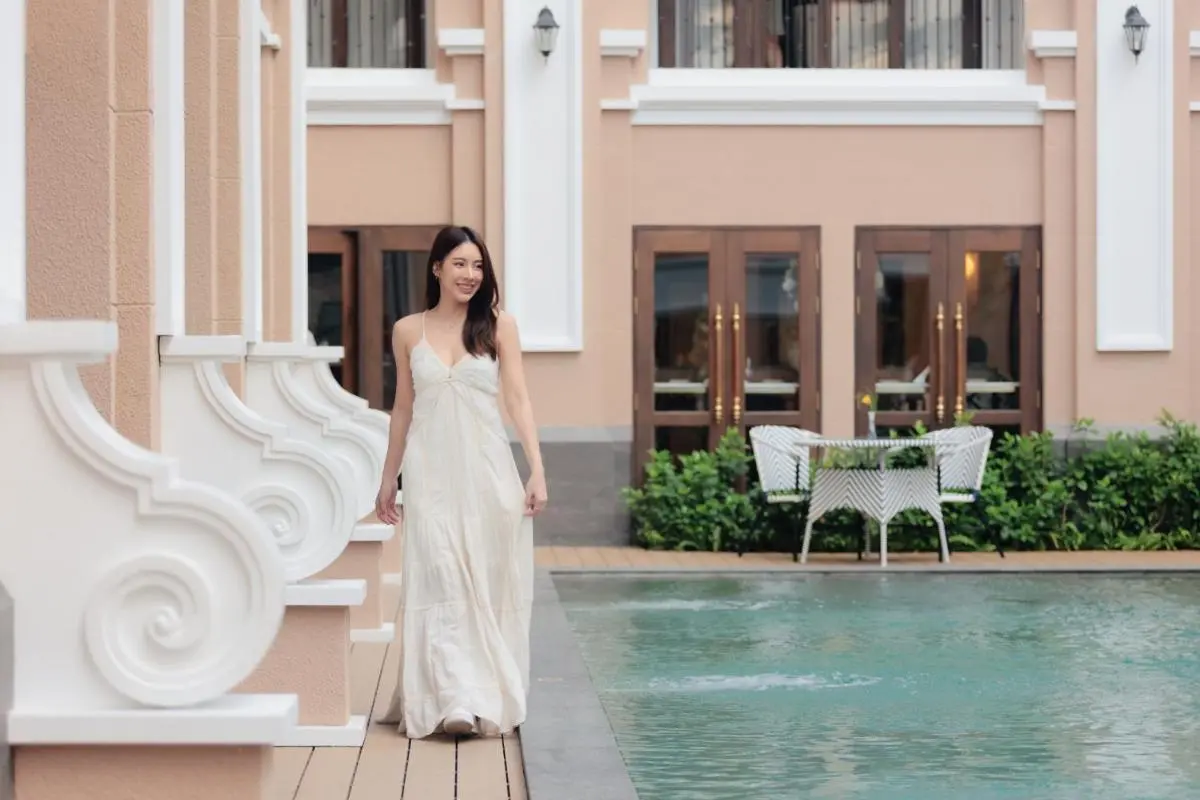 CHINO@NIMMAN Luxury Boutique Hotel Outdoor Pool Area with Wooden Deck and Seating in Chiang Mai City