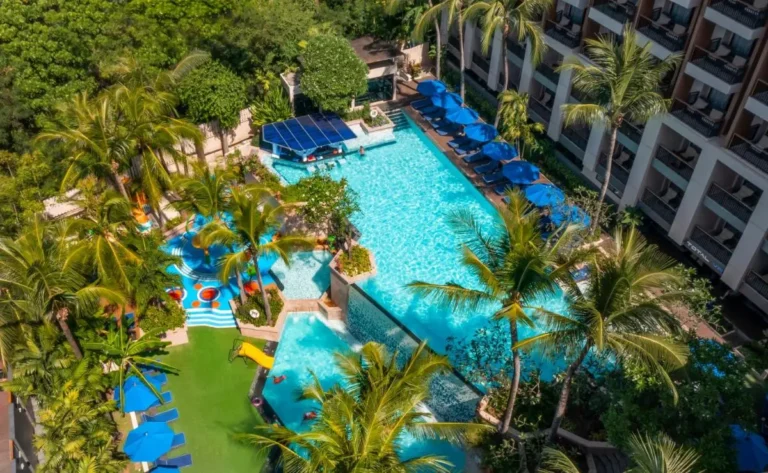 Outdoor Pool Complex with Swim-Up Bar and Children’s Slide at Tropical Location
