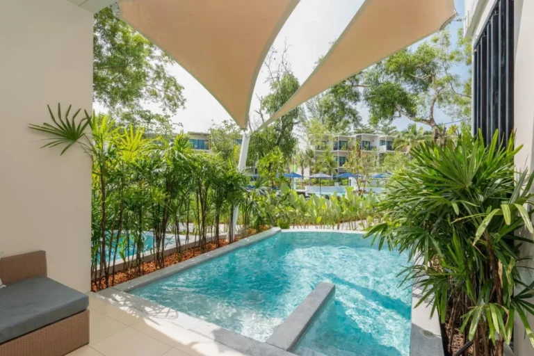 Outdoor Pools and Relaxation Areas with Canopies and Tropical Greenery at Mai Khao Beach Outdoor Pools and Relaxation Areas with Canopies and Tropical Greenery at Mai Khao Beach