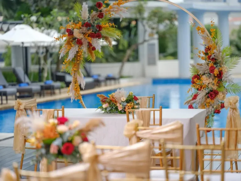 Outdoor Poolside Event Setup with Floral Arch and Lounge Seating at Robertson Quay