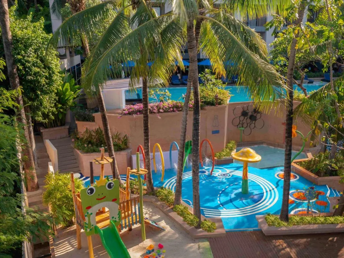 Outdoor Recreational Area with Children’s Splash Pool and Tropical Landscaping at Kata Beach