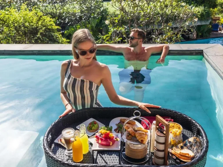 Outdoor Rectangular Pool with Floating Breakfast Tray and Relaxing Atmosphere at Karon Beach