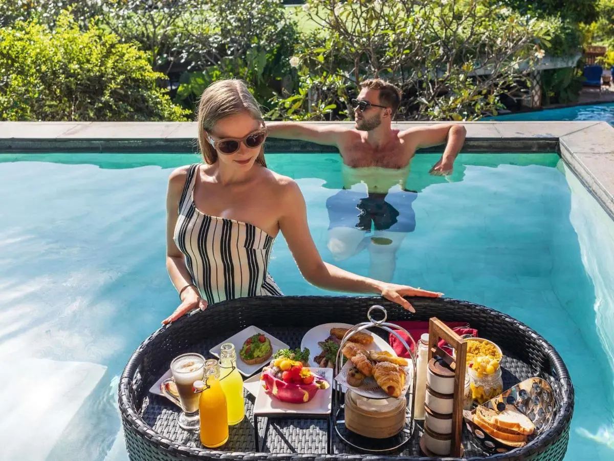 Outdoor Rectangular Pool with Floating Breakfast Tray and Relaxing Atmosphere at Karon Beach