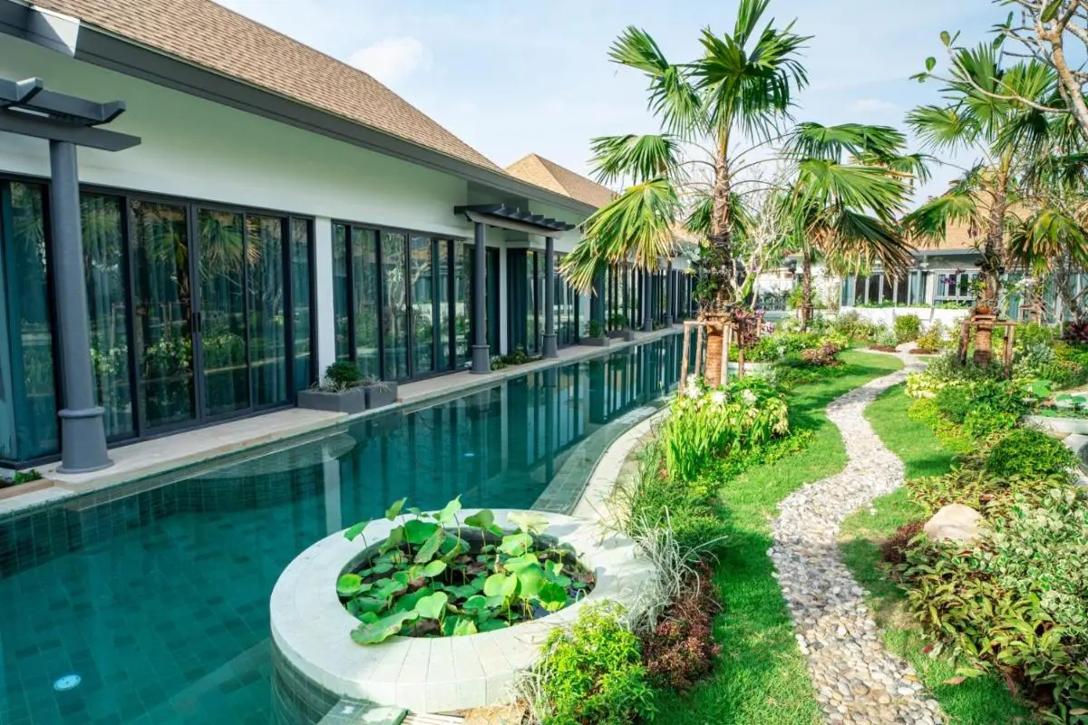Outdoor Rectangular Swimming Pool with Aquatic Garden and Stone Pathway in Chalong