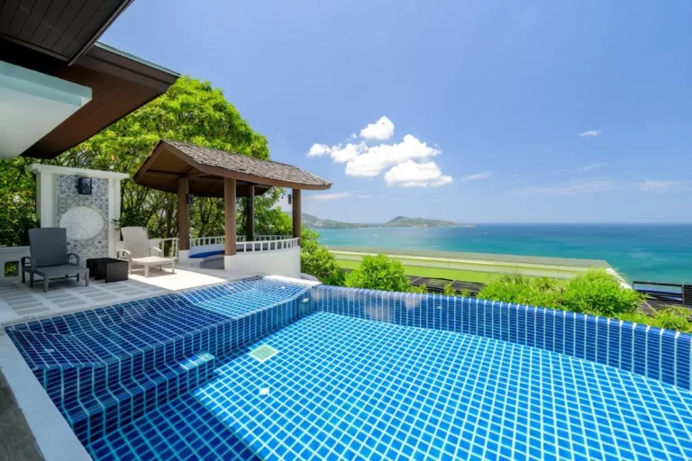Outdoor Rectangular Swimming Pool with Coastal Views and Relaxation Area at Patong Beach