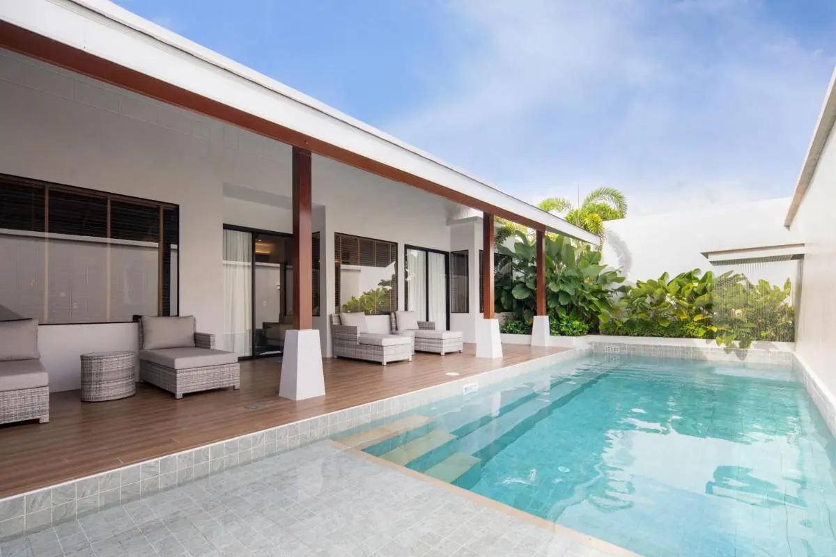 Outdoor Rectangular Swimming Pool with Covered Patio and Lounge Area in Thalang