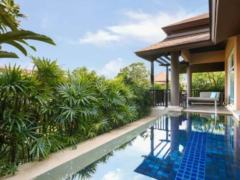 Outdoor Rectangular Swimming Pool with Covered Patio and Tropical Greenery at Panwa Beach