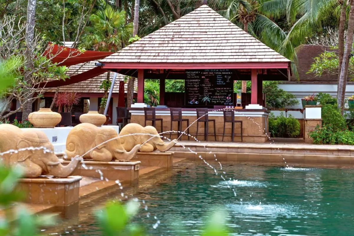 Marriott's Phuket Beach Club Outdoor Rectangular Swimming Pool with Elephant Water Spouts and Thatched Bar at Mai Khao Beach Phuket Province