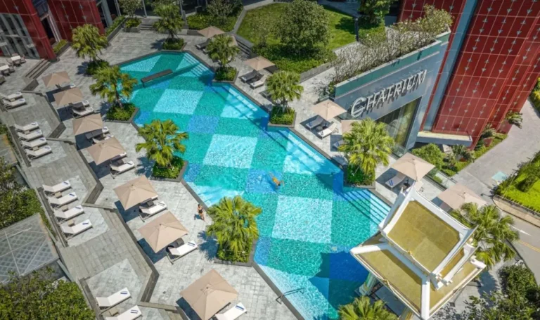 Outdoor Rectangular Swimming Pool with Geometric Tiles and Lounge Area in Ratchathewi Bangkok