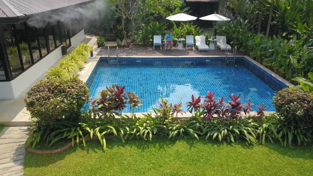 Sannot Riverside Boutique Hotel Outdoor Rectangular Swimming Pool with Lounge Area and Greenery in Wat Ket Chiang Mai
