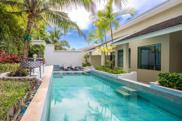 Outdoor Rectangular Swimming Pool with Lounge Area and Tropical Plants in Phuket Town