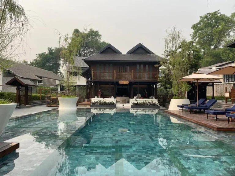 Outdoor Rectangular Swimming Pool with Lounge Area and Wooden Deck in Chiang Mai