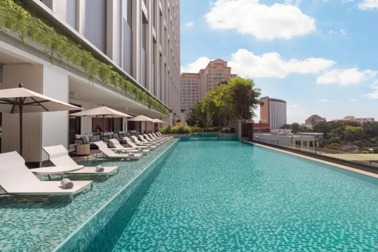 Outdoor Rectangular Swimming Pool with Lounge Chairs and City Views in Chang Khlan Chiang Mai