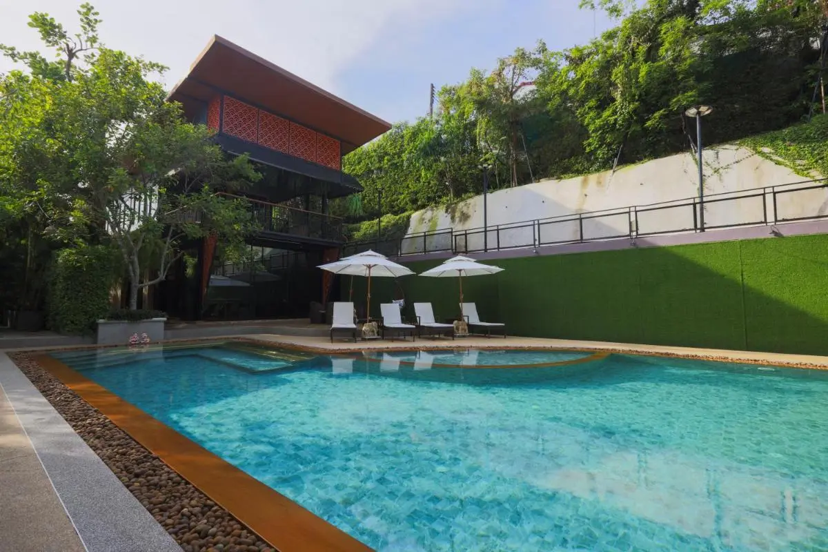 Alaita Boutique Phuket Outdoor Rectangular Swimming Pool with Lounge Chairs and Modern Building in Ban Bo Rae Phuket Province