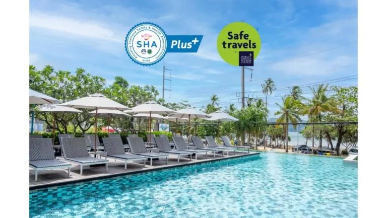 Outdoor Rectangular Swimming Pool with Lounge Chairs and Ocean View at Patong Beach