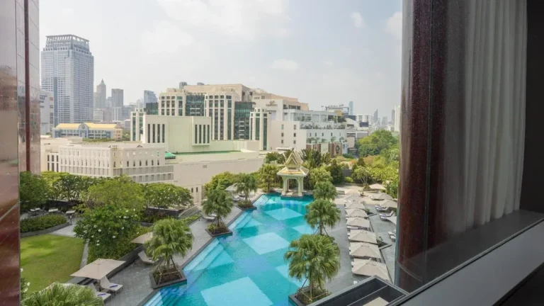 Outdoor Rectangular Swimming Pool with Lounge Chairs and Pavilion in Ratchathewi Urban Area