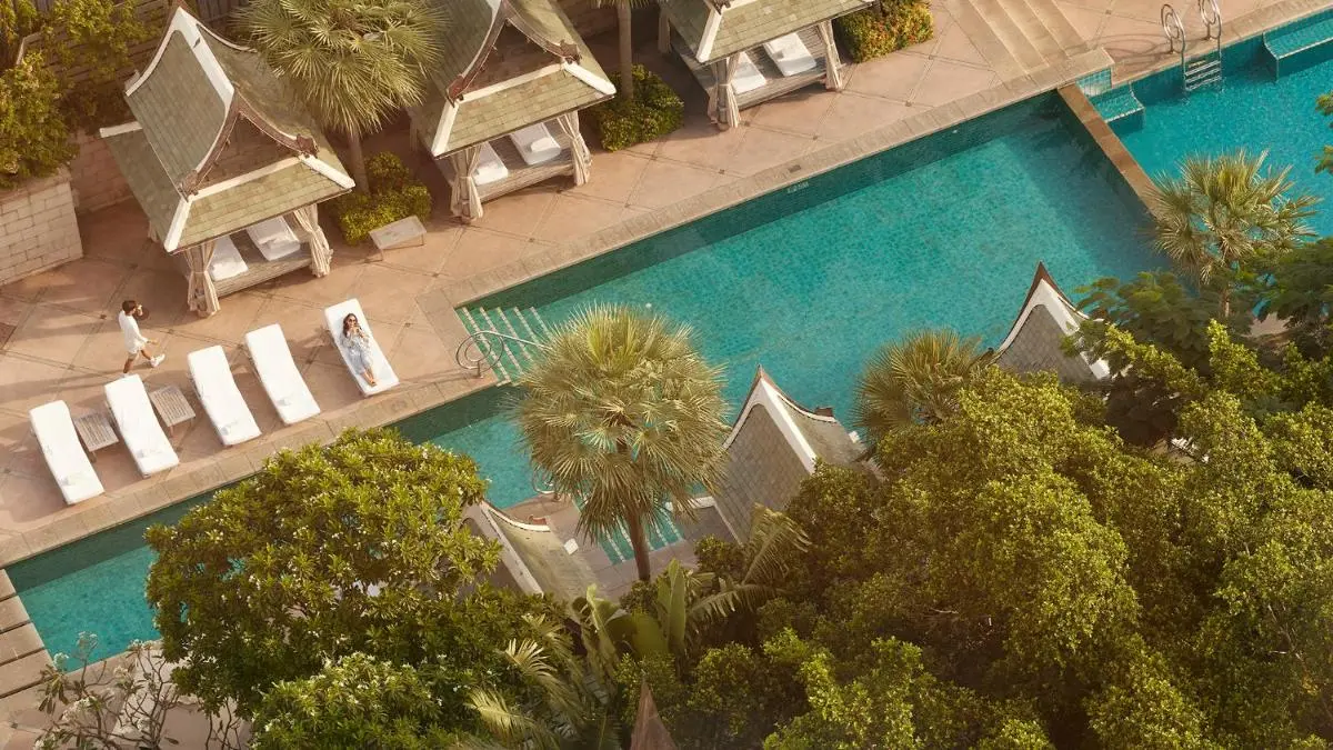 Outdoor Rectangular Swimming Pool with Lounge Chairs and Pavilions in Khlong San Bangkok