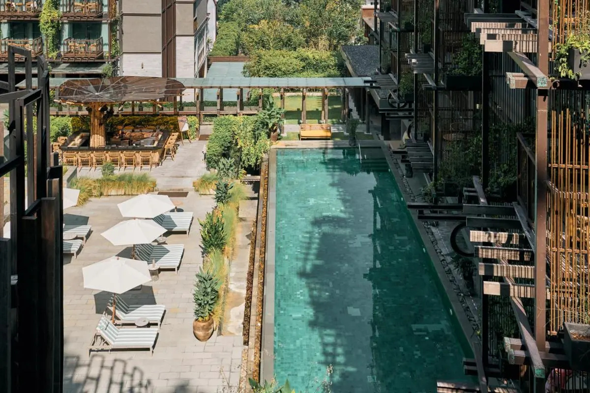 Outdoor Rectangular Swimming Pool with Lounge Chairs and Pergola at Patong Beach