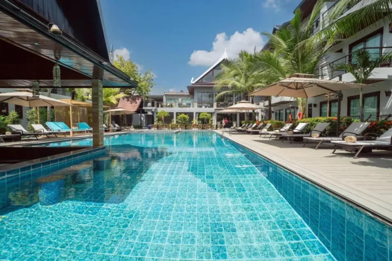 Outdoor Rectangular Swimming Pool with Lounge Chairs and Poolside Bar in Thalang