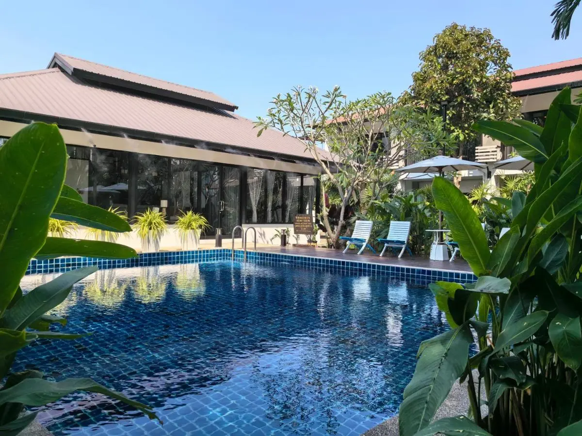 Outdoor Rectangular Swimming Pool with Lounge Chairs and Shaded Deck in Wat Ket Chiang Mai