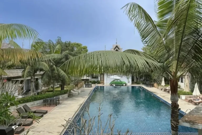 Outdoor Rectangular Swimming Pool with Lounge Chairs and Tropical Vegetation in Chiang Mai