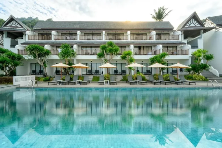 Outdoor Rectangular Swimming Pool with Lounge Chairs and Umbrellas at Patong Beach