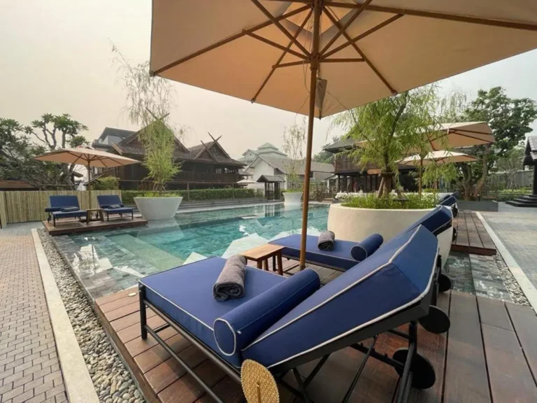 Outdoor Rectangular Swimming Pool with Lounge Chairs and Umbrellas in Chiang Mai