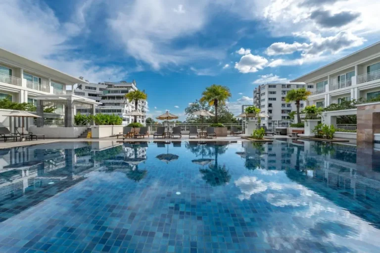 Outdoor Rectangular Swimming Pool with Lounge Chairs and Umbrellas in Chiang Mai City